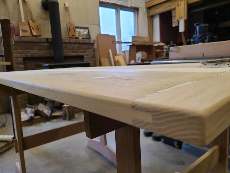 An antique table being restored in the Artisanal Restoration workshop