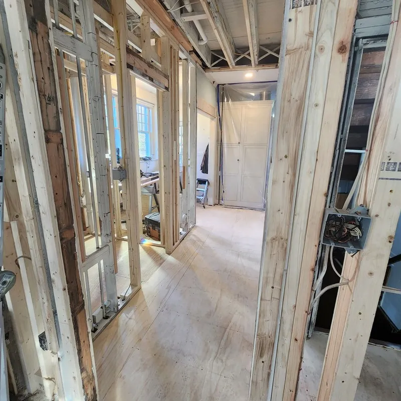 The first floor reframed, with new subfloor installed.